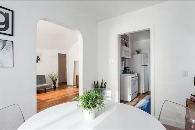 3119 Larga Ave, Los Angeles, CA 90039 - dining space with arched walkways and wood finished floors