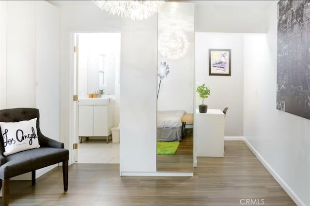 3119 Larga Ave, Los Angeles, CA 90039 - sitting room featuring a chandelier, wood finished floors, and baseboards
