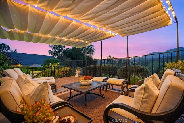 6617 Oak Forest Dr, Oak Park, CA 91377 - patio terrace at dusk with an outdoor hangout area and a deck with mountain view