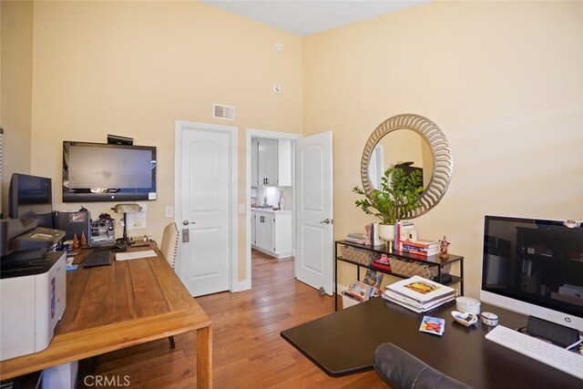 6617 Oak Forest Dr, Oak Park, CA 91377 - office area with light wood-type flooring and a high ceiling