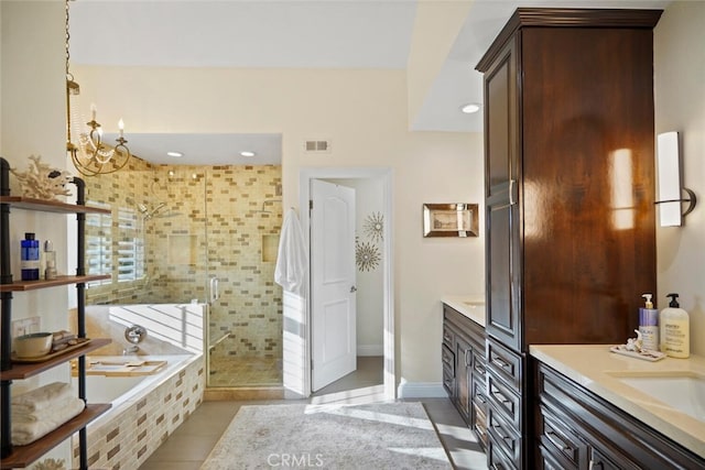 6617 Oak Forest Dr, Oak Park, CA 91377 - bathroom featuring vanity, a shower stall, tile patterned flooring, a garden tub, and a chandelier