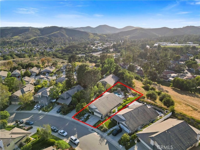 6617 Oak Forest Dr, Oak Park, CA 91377 - aerial perspective of suburban area featuring a mountainous background and property parcel outlined