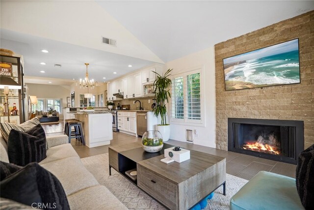 6617 Oak Forest Dr, Oak Park, CA 91377 - living area featuring a chandelier, a large fireplace, recessed lighting, and lofted ceiling