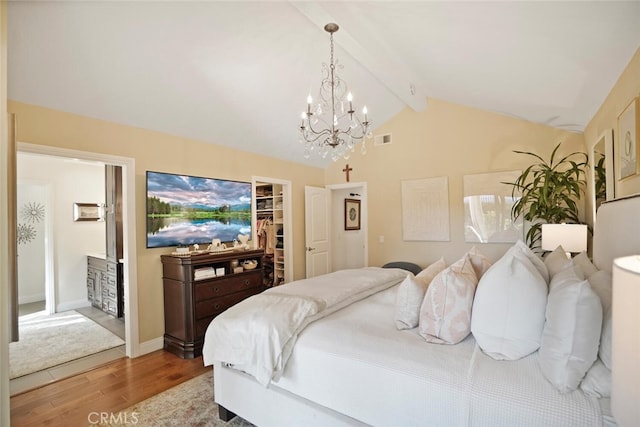 6617 Oak Forest Dr, Oak Park, CA 91377 - bedroom featuring a chandelier, wood finished floors, a walk in closet, and a closet