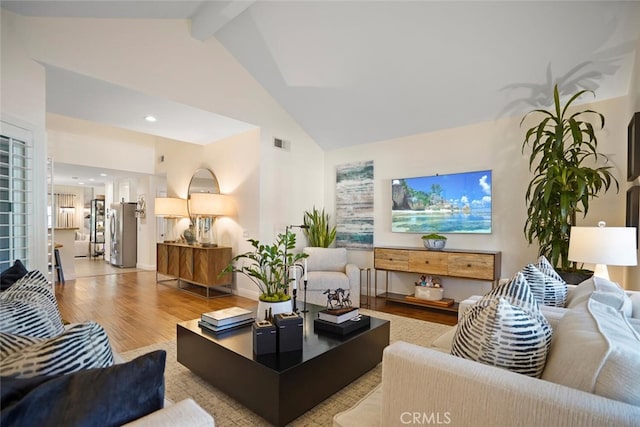 6617 Oak Forest Dr, Oak Park, CA 91377 - living area featuring wood finished floors, high vaulted ceiling, beamed ceiling, and baseboards