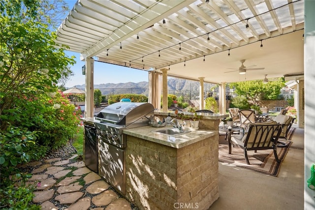 6617 Oak Forest Dr, Oak Park, CA 91377 - view of patio / terrace featuring a sink, a ceiling fan, a mountain view, and outdoor dining space