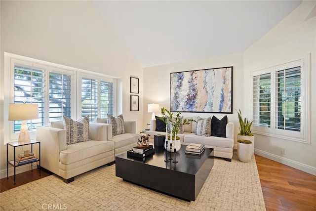 6617 Oak Forest Dr, Oak Park, CA 91377 - living room featuring wood finished floors, healthy amount of natural light, baseboards, and high vaulted ceiling