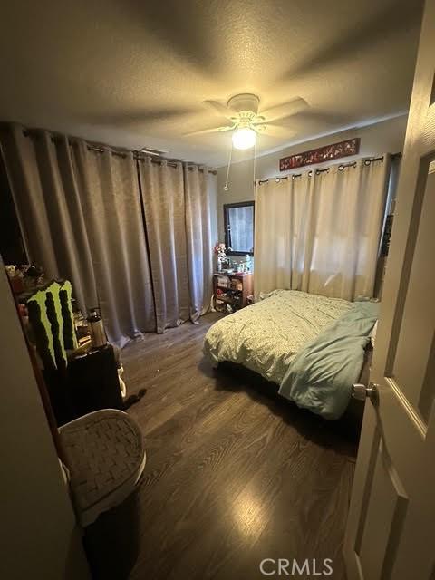 11420 Lasselle St, Moreno Valley, CA 92557 - bedroom featuring wood finished floors and a ceiling fan
