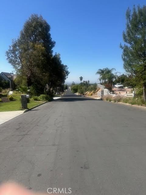 11420 Lasselle St, Moreno Valley, CA 92557 - view of asphalt road with curbs