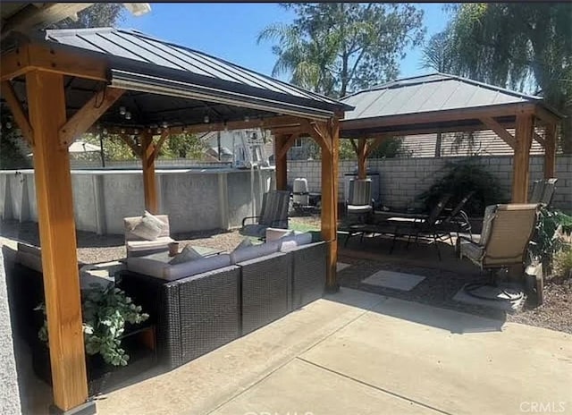 11420 Lasselle St, Moreno Valley, CA 92557 - fenced backyard with a gazebo, an outdoor living space, and a patio