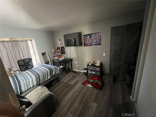 11420 Lasselle St, Moreno Valley, CA 92557 - bedroom featuring wood finished floors, a textured ceiling, and baseboards