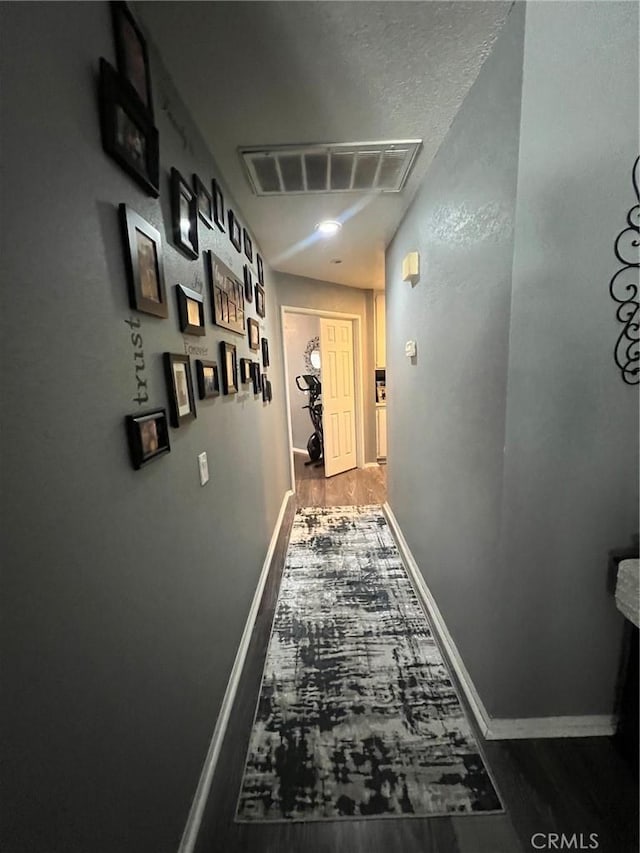 11420 Lasselle St, Moreno Valley, CA 92557 - hall with baseboards and dark wood finished floors