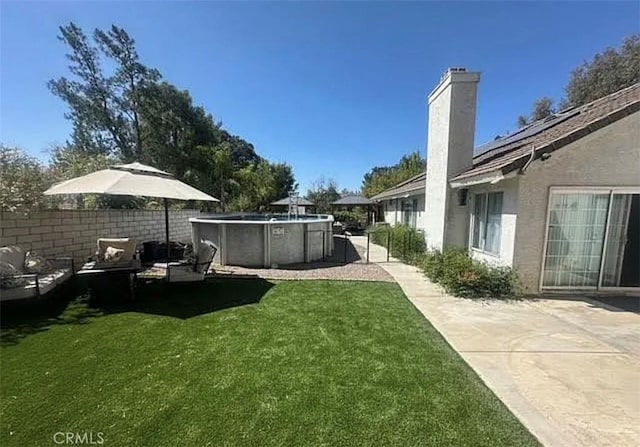 11420 Lasselle St, Moreno Valley, CA 92557 - view of grassy yard with a patio area