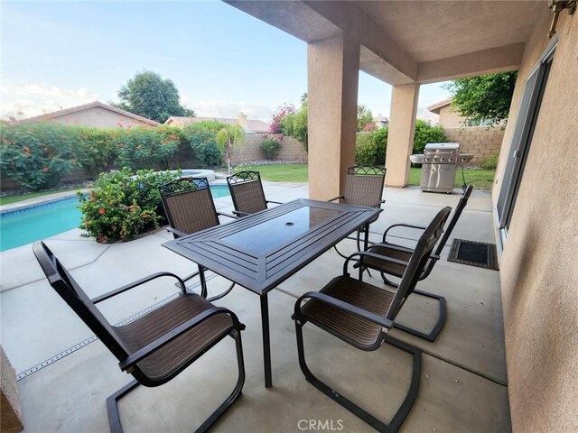 43620 Brahea Ct, Indio, CA 92201 - fenced backyard featuring grilling area, a patio area, and outdoor dining space