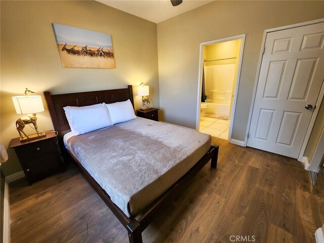 43620 Brahea Ct, Indio, CA 92201 - bedroom featuring wood finished floors, connected bathroom, and baseboards