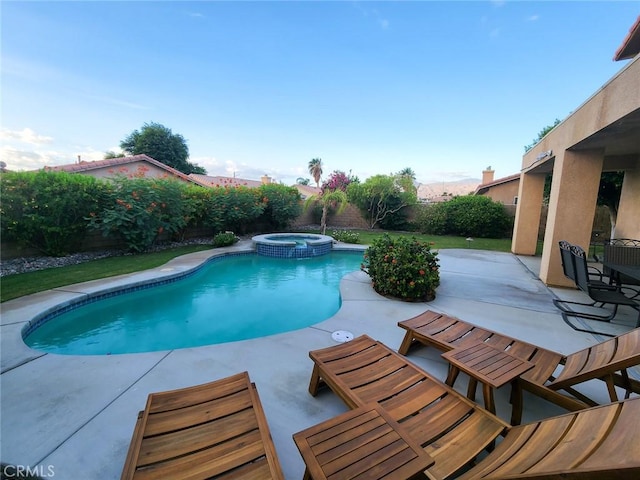 43620 Brahea Ct, Indio, CA 92201 - view of swimming pool featuring a patio, a fenced backyard, and a pool with connected hot tub