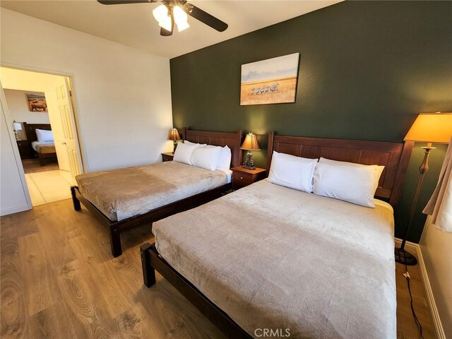 43620 Brahea Ct, Indio, CA 92201 - bedroom with wood finished floors and ceiling fan