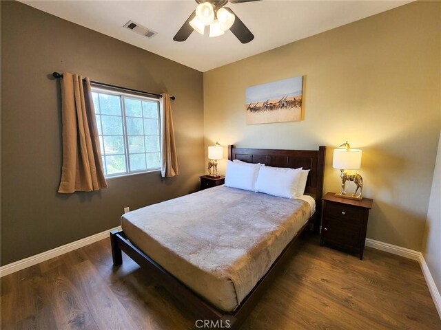 43620 Brahea Ct, Indio, CA 92201 - bedroom with dark wood-style flooring, baseboards, and a ceiling fan