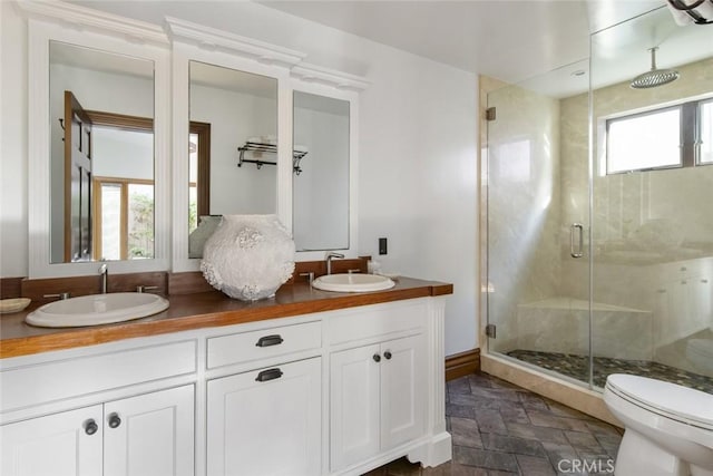 929 Lake St, Venice, CA 90291 - full bathroom featuring stone finish flooring, toilet, a shower stall, and double vanity