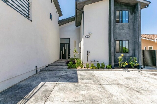 17465 Tuscan Dr, Granada Hills, CA 91344 - entrance to property with stucco siding and a patio area