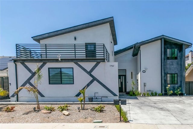 17465 Tuscan Dr, Granada Hills, CA 91344 - contemporary house with stucco siding and a balcony