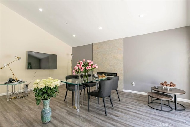 17465 Tuscan Dr, Granada Hills, CA 91344 - dining space with wood finished floors, baseboards, vaulted ceiling, and recessed lighting
