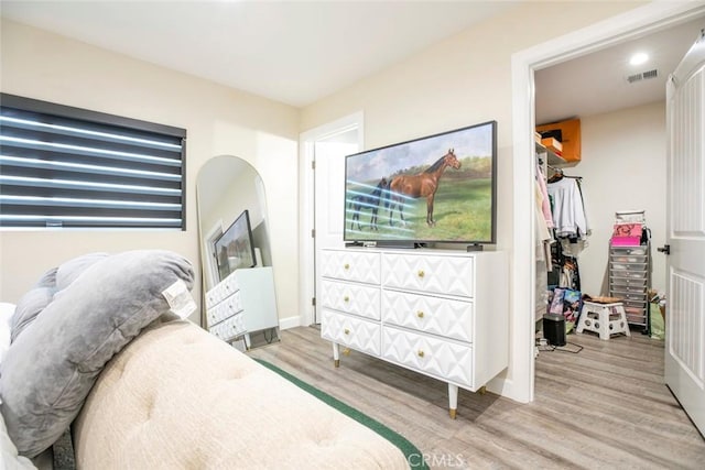 17465 Tuscan Dr, Granada Hills, CA 91344 - bedroom with light wood-style floors and a walk in closet