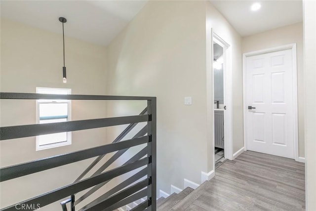 17465 Tuscan Dr, Granada Hills, CA 91344 - hallway featuring an upstairs landing, baseboards, wood finished floors, and recessed lighting