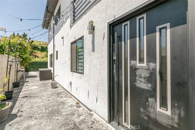 17465 Tuscan Dr, Granada Hills, CA 91344 - view of home's exterior with a fenced backyard, a patio area, cooling unit, and stucco siding