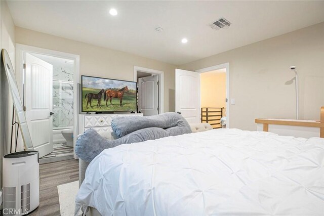 17465 Tuscan Dr, Granada Hills, CA 91344 - bedroom featuring wood finished floors, recessed lighting, and ensuite bath