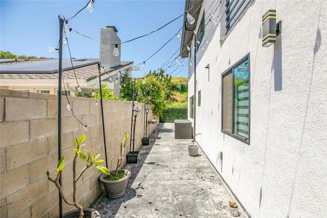17465 Tuscan Dr, Granada Hills, CA 91344 - view of side of property with a fenced backyard, stucco siding, and a patio