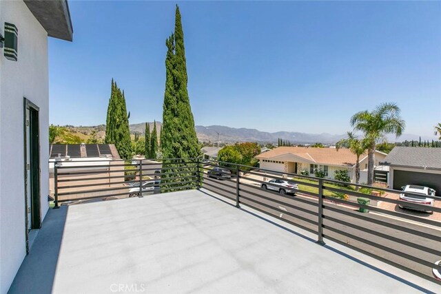 17465 Tuscan Dr, Granada Hills, CA 91344 - view of patio / terrace featuring a balcony, a mountain view, and a residential view