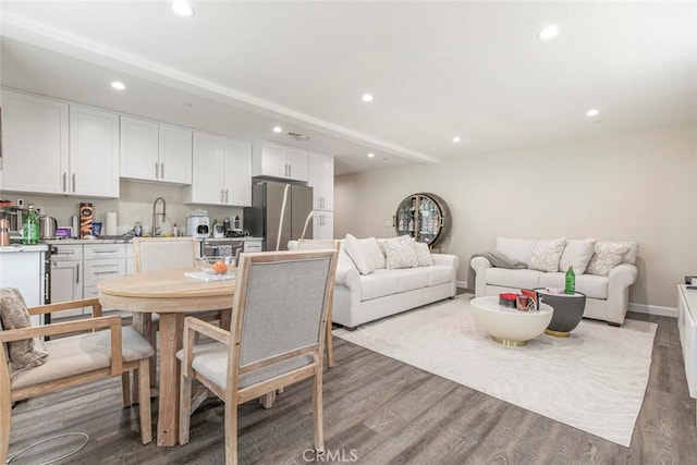 17465 Tuscan Dr, Granada Hills, CA 91344 - dining space with recessed lighting, wood finished floors, and baseboards