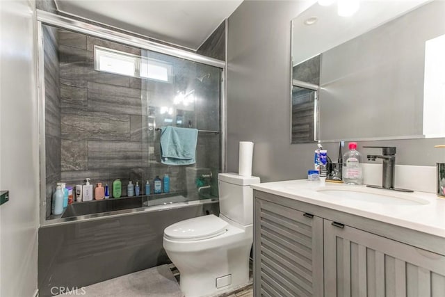 17465 Tuscan Dr, Granada Hills, CA 91344 - bathroom featuring toilet, combined bath / shower with glass door, and vanity