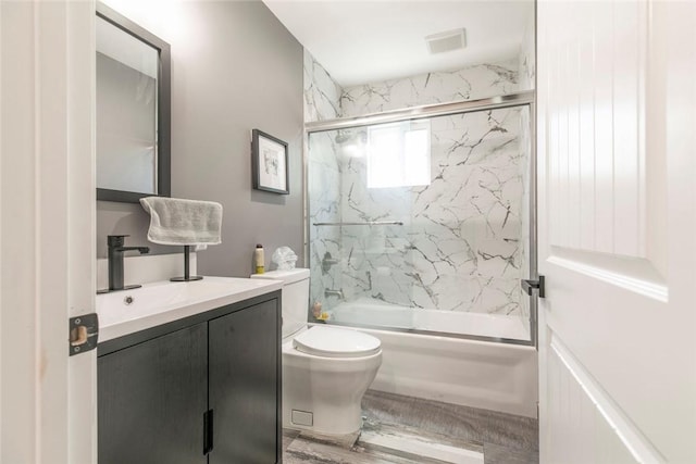 17465 Tuscan Dr, Granada Hills, CA 91344 - bathroom featuring shower / bath combination with glass door, toilet, and vanity