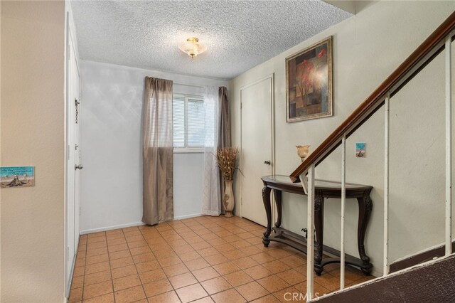 756 W Fontlee Ln, Rialto, CA 92376 - entrance foyer featuring a textured ceiling