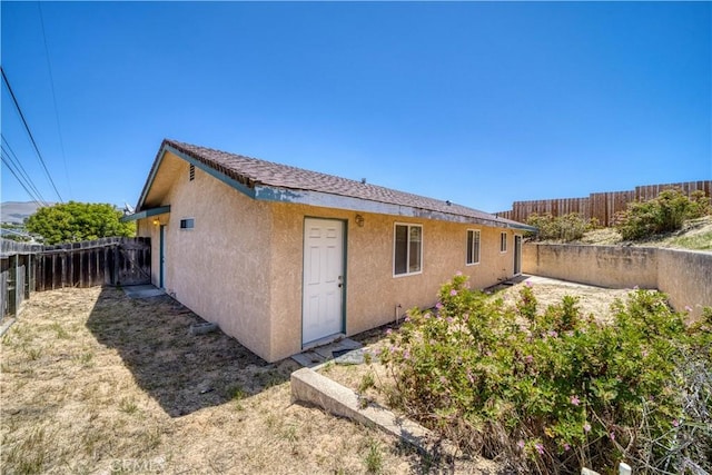 502 Robert Ct, Nipomo, CA 93444 - back of house with stucco siding and a fenced backyard