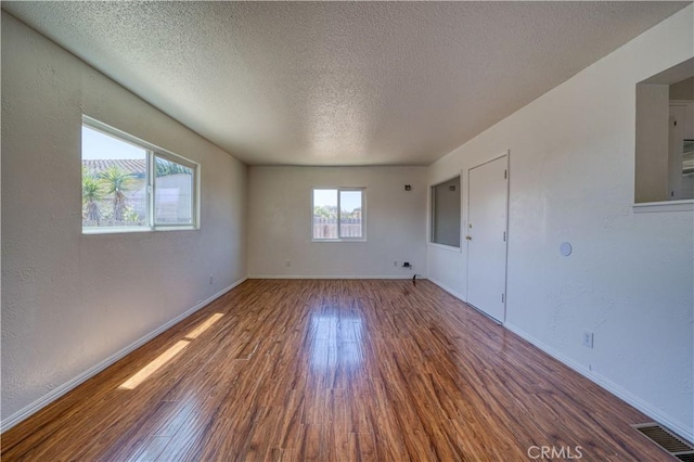 502 Robert Ct, Nipomo, CA 93444 - spare room featuring wood finished floors, a textured ceiling, and baseboards