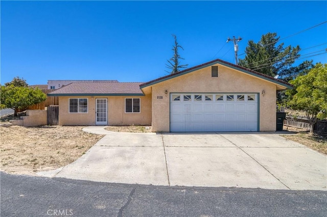 502 Robert Ct, Nipomo, CA 93444 - ranch-style house with stucco siding, an attached garage, and driveway