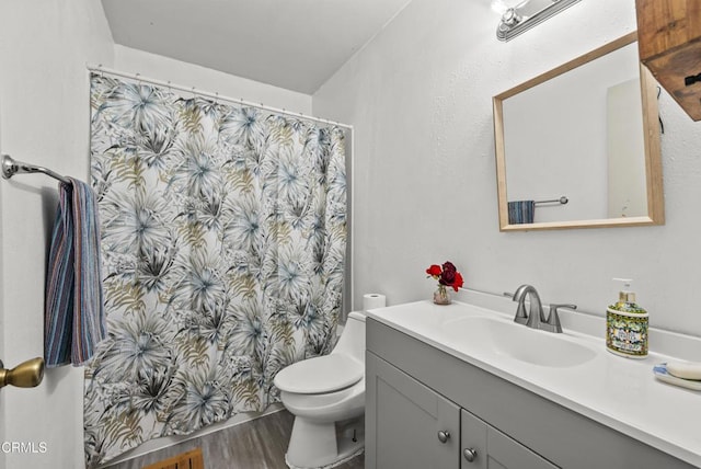 1531 Lakehurst St, Oxnard, CA 93030 - full bathroom with vanity, wood finished floors, toilet, and curtained shower
