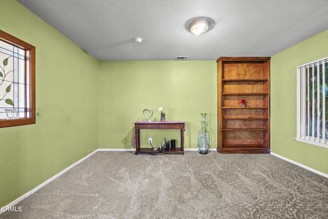 1531 Lakehurst St, Oxnard, CA 93030 - spare room featuring carpet flooring, baseboards, and built in features