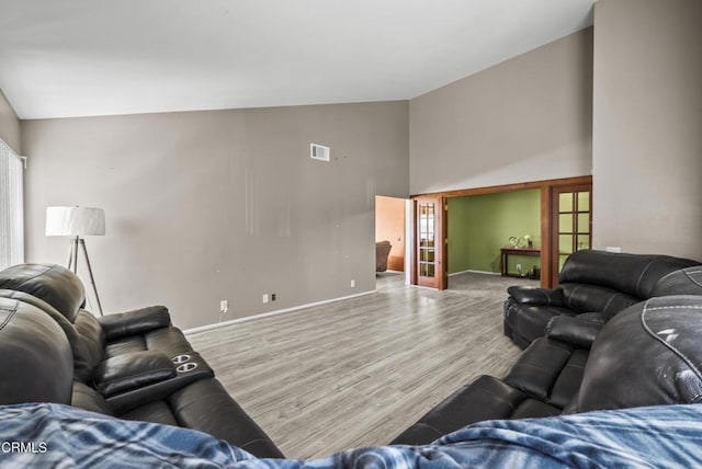 1531 Lakehurst St, Oxnard, CA 93030 - living area with high vaulted ceiling, baseboards, and wood finished floors