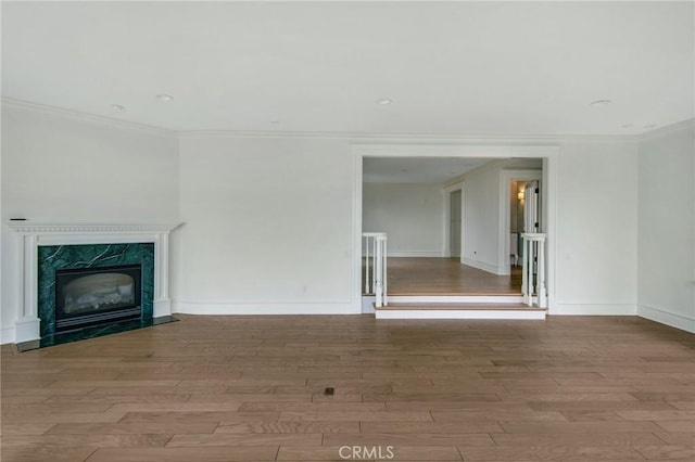 2163 Crestview Dr, Laguna Beach, CA 92651 - unfurnished living room with wood finished floors, ornamental molding, baseboards, and a high end fireplace