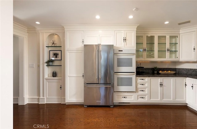 2163 Crestview Dr, Laguna Beach, CA 92651 - kitchen with high quality fridge, white double oven, glass insert cabinets, white cabinets, and dark stone counters