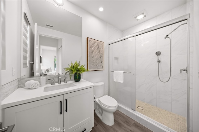 59 Longchamp, Irvine, CA 92602 - full bath with toilet, a stall shower, vanity, and wood finished floors