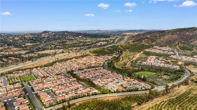 59 Longchamp, Irvine, CA 92602 - aerial view of property's location featuring nearby suburban area and mountains