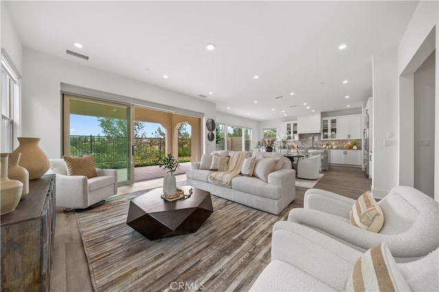 59 Longchamp, Irvine, CA 92602 - living area featuring recessed lighting and wood finished floors