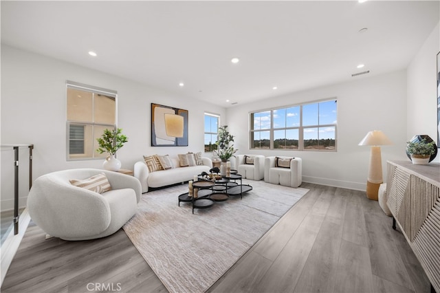 59 Longchamp, Irvine, CA 92602 - living area featuring wood finished floors, recessed lighting, and baseboards