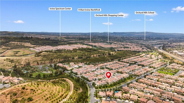 59 Longchamp, Irvine, CA 92602 - aerial view of property's location featuring nearby suburban area and a mountainous background