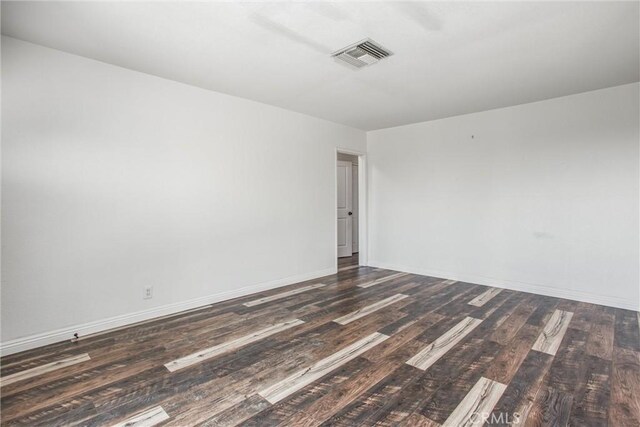 240 E 52nd St, San Bernardino, CA 92404 - spare room featuring dark wood finished floors and baseboards